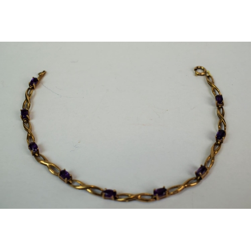 597 - 9ct Yellow Gold Amethyst set bracelet. 7 inches long.  4.1g