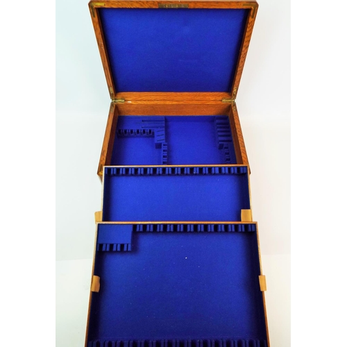 611 - Oak velvet lined cutlery box with close fitting interal drop in trays. Flush recessed brass handles.... 