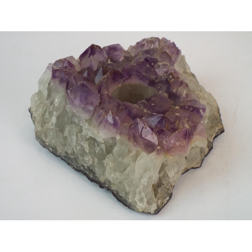 672 - Large amethyst quartz cluster geode as a candle holder. 3.5