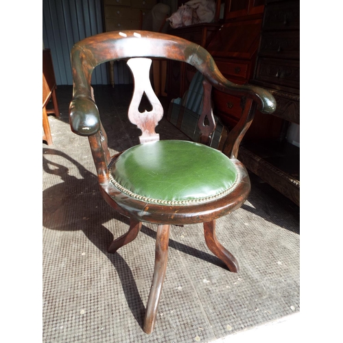 922 - Darkwood smokers chair with green leather seat supported by bracket legs. Decorative splats and side... 