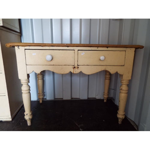 925 - Antique pine table with two cutlery drawers to side. Leatherette covered table top which may need so... 