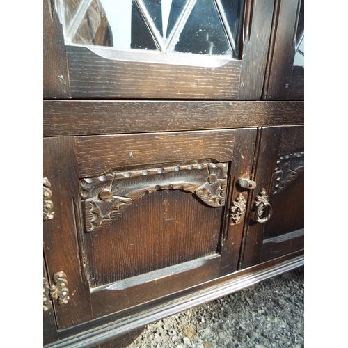 931 - Darkwood Corner cabinet with leaded glazed doors to top H:39 x W:29 x D:15 inches . See photos