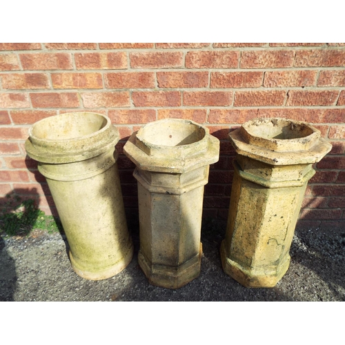 932 - Three old earthenware chimney pots to make good garden planters. Each approx 27 inches tall. See pho... 