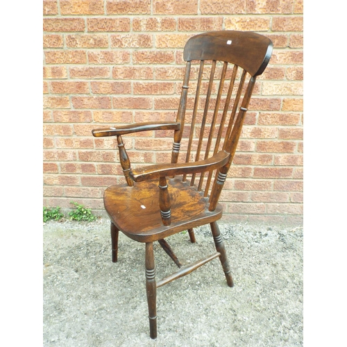 951 - Antique stick back style armchair with turned legs.