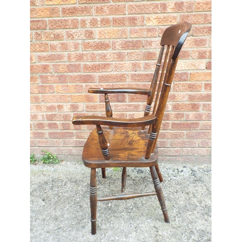 951 - Antique stick back style armchair with turned legs.