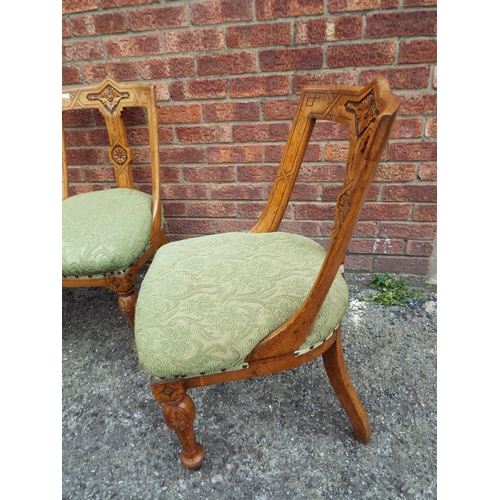 952 - Set of five carved light oak dining chairs with turned legs and spats. Upholstered in a green materi... 