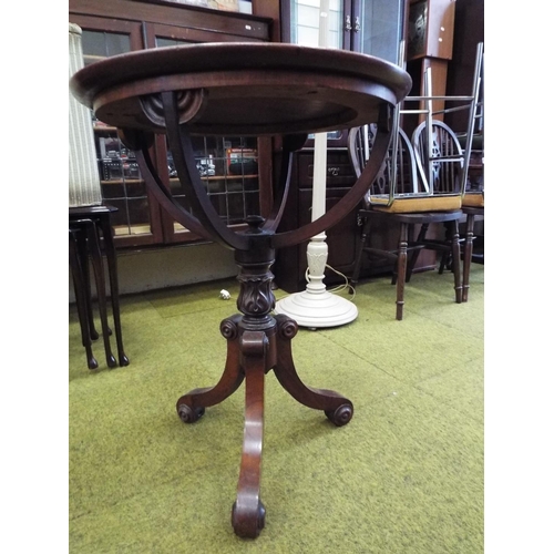 996 - Victorian circular topped table supported on three carved bracket legs on a carved and turned centra... 