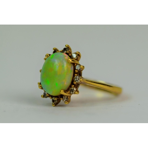 521a - 9ct Yellow Gold Ring set with a 10 x 5 mm Opal surrounded by a Halo of 12 Melee Diamonds of 1/100th ... 