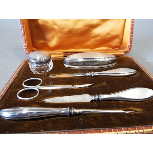 796 - Vintage manicure set with sterling silver handles and tops in original case.