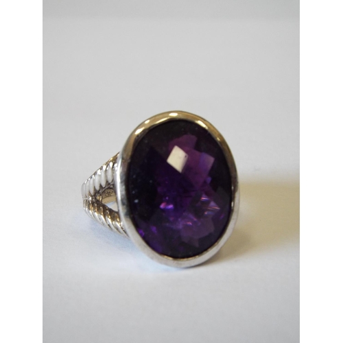 810 - Sterling silver ring by TJC with large purple stone, size P