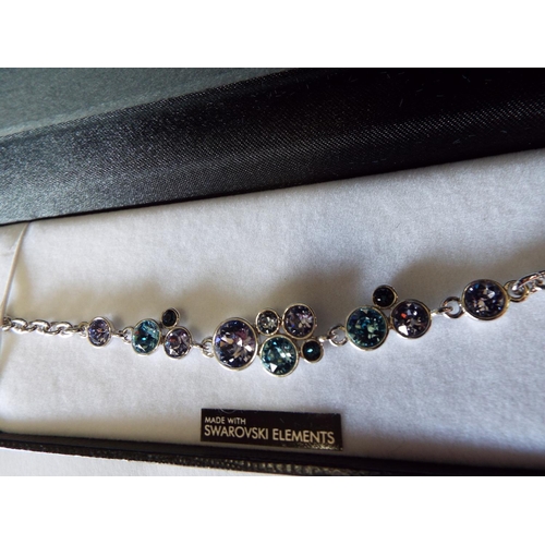 822 - Warren James bracelet swarovski elemements with lilac and blue stones.