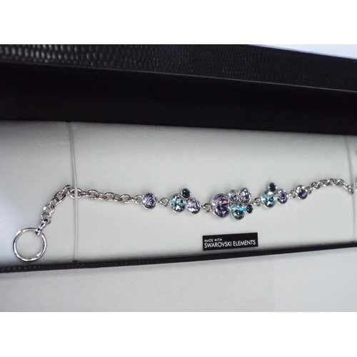 822 - Warren James bracelet swarovski elemements with lilac and blue stones.