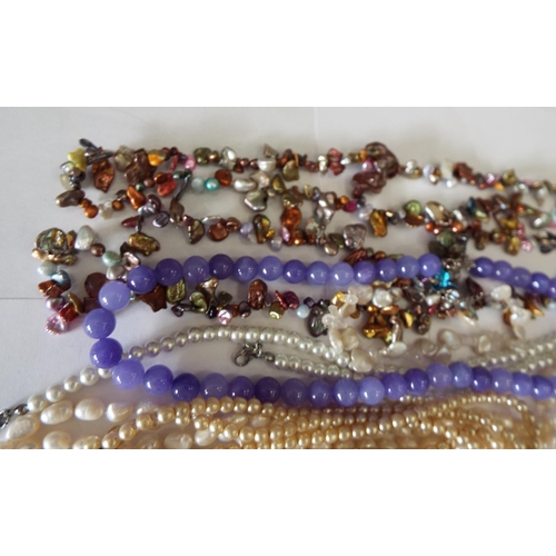 827 - Selection of pearl and faux pearl necklaces etc.