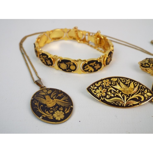 851 - Set of gold tone with etched bird and flower design necklace, brooch and earrings.