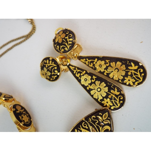 851 - Set of gold tone with etched bird and flower design necklace, brooch and earrings.