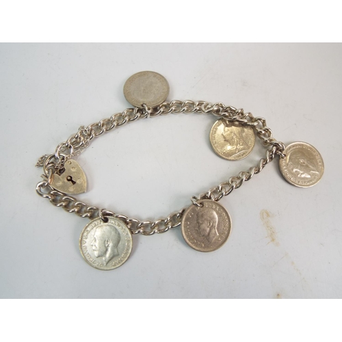 860 - Sterling silver charm bracelet and a sterling silver 3 pence bracelet.