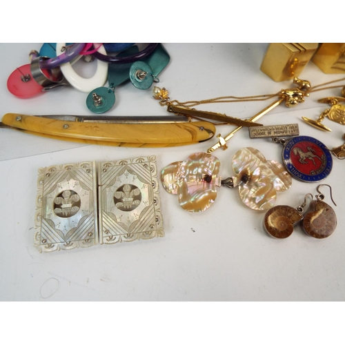 866 - Good mix of costume jewelley including 9ct gold bell earrings , Mop belt buckles etc.