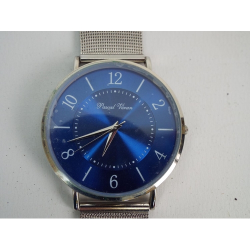 877 - Pascal varon mens watch with stainless steel bracelet. Requires new battery to run.