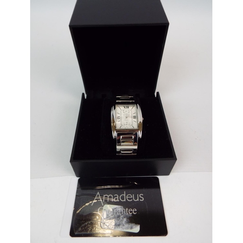 886 - Boxed Amadeus watch in working condition.