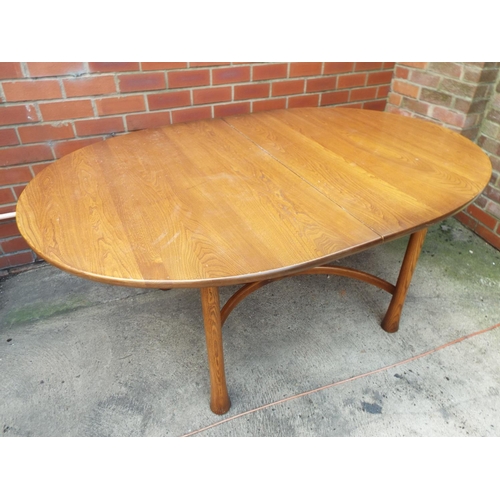 1024 - Ercol Oval table with curved stretchers under. Will need refurbishment. H:29 x W:64 x D:42 inches . ... 