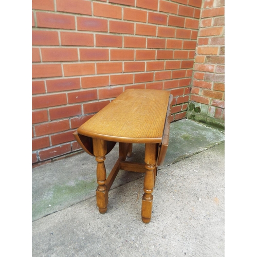 1027 - Small Ercol style drop leaf dircular topped space saving table.  H:18 x 30inches in Diameter. See ph... 