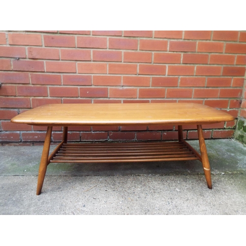 1030 - Ercol low coffee table with barrel turned legs and magazine rack under  H:14 x W:41 x D:18 inches . ... 