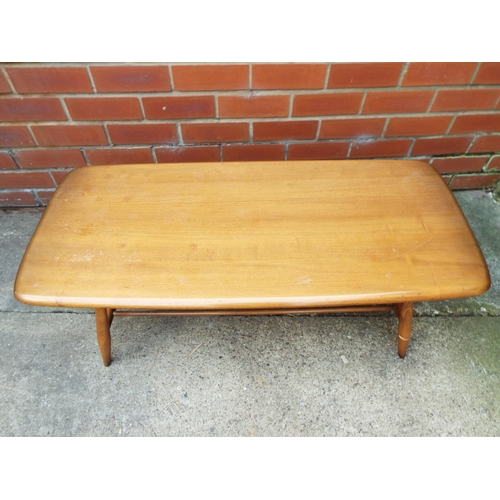 1030 - Ercol low coffee table with barrel turned legs and magazine rack under  H:14 x W:41 x D:18 inches . ... 