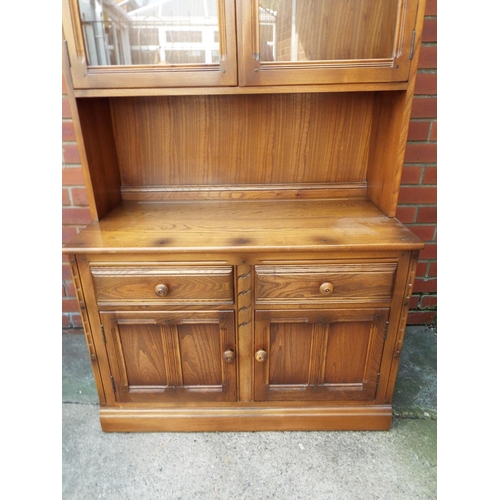 1032 - Ercol Cupboard with two doors and glazed doors above. Comes in two pieces for ease of movement. H:77... 