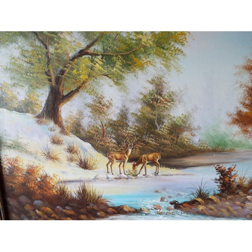 1040 - Framed oil on board of two deers in a woodland setting . See photos