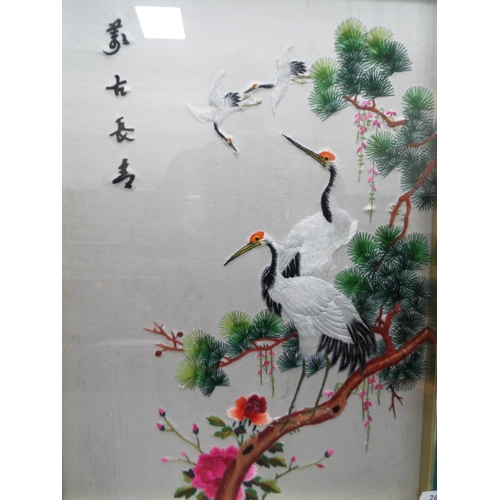 1064 - Framed and recessed mounted embroidered on silk picture of Japanese white cranes.  22 x 17 inches. S... 