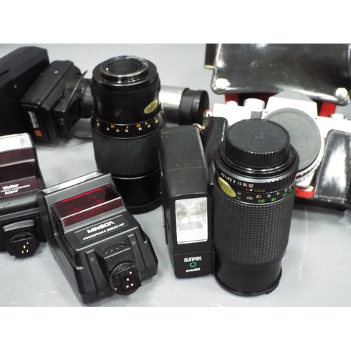 1145 - Selection of vintage cameras lenses and flashes.