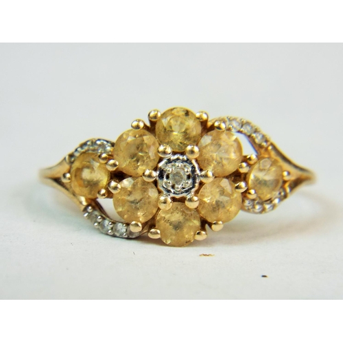 546a - 9ct Yellow gold ring with tiny diamond to centre and yellow cushion cut stones in a flower pattern F... 