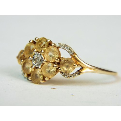 546a - 9ct Yellow gold ring with tiny diamond to centre and yellow cushion cut stones in a flower pattern F... 