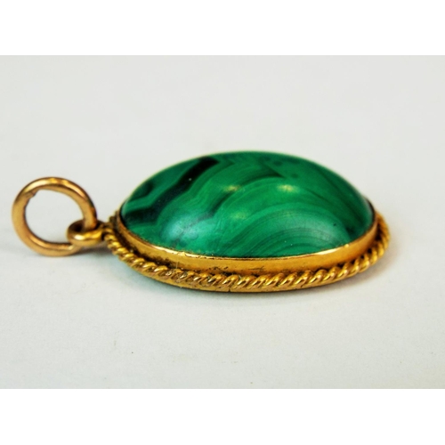 547a - Victorian era Malachite set mourning pendant with clear glass back mounted in unmarked yellow gold w... 