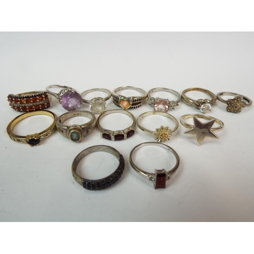 849a - Fourteen 925 Silver, stone set rings . see photos