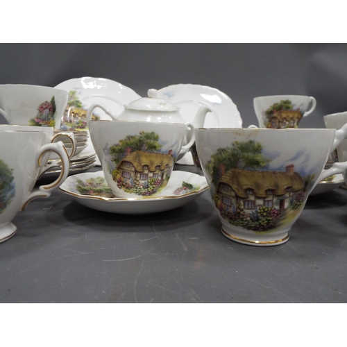 1274 - Tea set with a country cottage pattern 40 pieces in total.