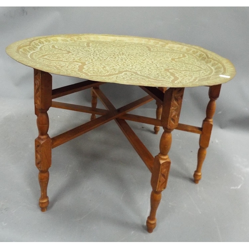 1324 - Large Indian brass charger table with collapsable base.