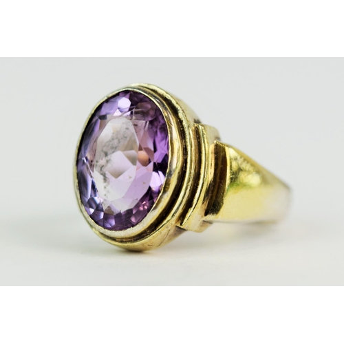 121 - Hallmarked Silver Gilt Ring. Set with large amethyst coloured stone Finger size 'T'  12.6g