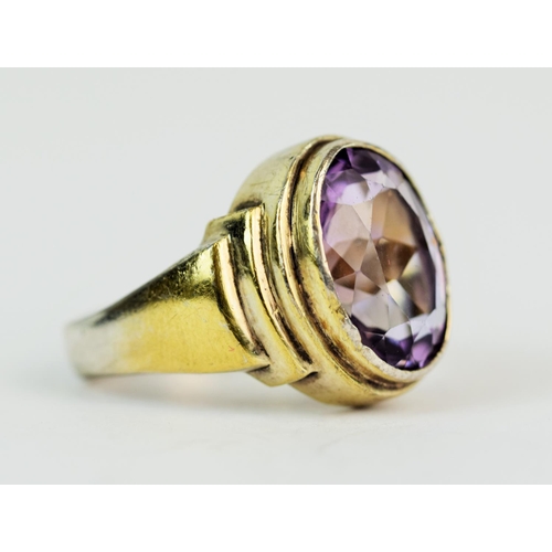 121 - Hallmarked Silver Gilt Ring. Set with large amethyst coloured stone Finger size 'T'  12.6g