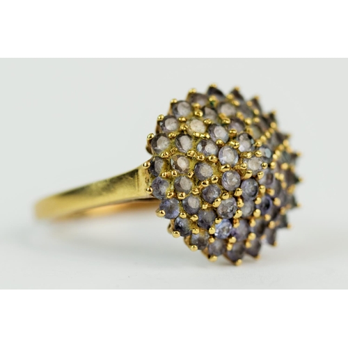 131 - 9ct Yellow Gold ring set with multiple quartz of hazy liliac colour. Finger size 'W'  4.5g