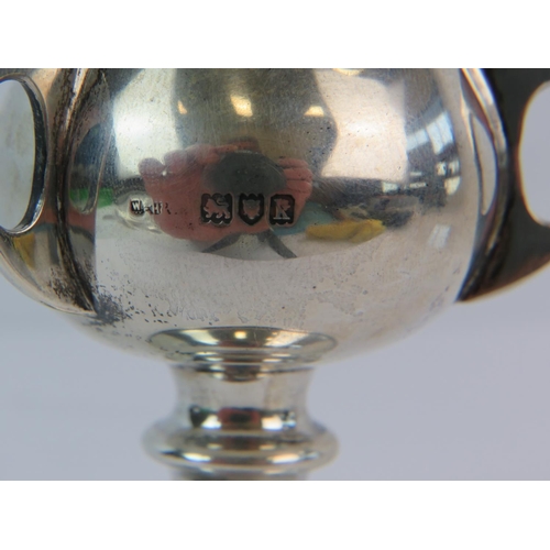 154 - Halllmarked Silver three handled trophy. 3.5 inches tall. 45.2g