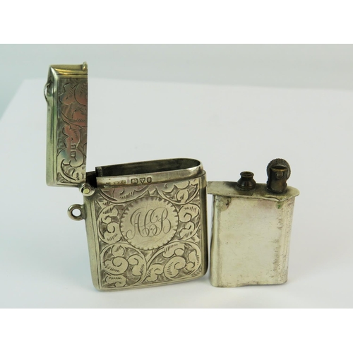 160 - Hallmarked Silver Vesta with scrolled decorations, Chester Hallmarks. Has detachable lighter body wi... 