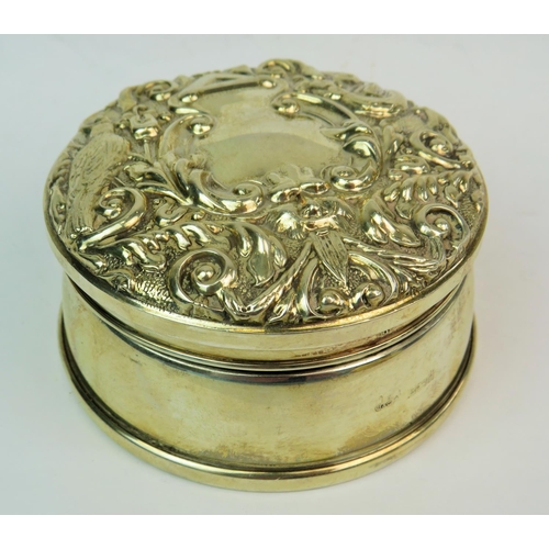 192 - Pretty hinged Lidded Silver Jewellery box with Damask velvet interior. Repouse raised decoration to ... 