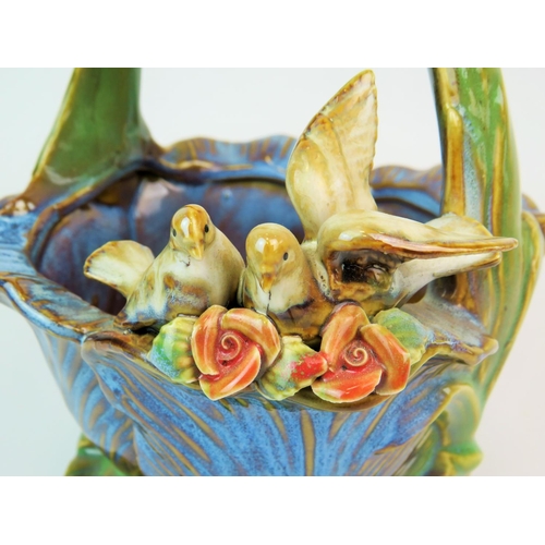 214 - Pretty Majolica posy basket decorated with Doves in a Tulip base, no damage. Approx 9 inches tall. S... 