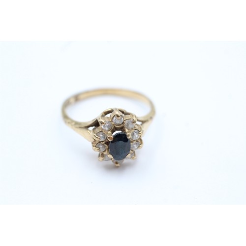 70 - 9ct gold sapphire & clear gemstone halo ring (2.6g)         5945