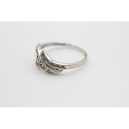 79 - 9ct white gold diamond 'i love you' bypass ring (2.2g)         2460