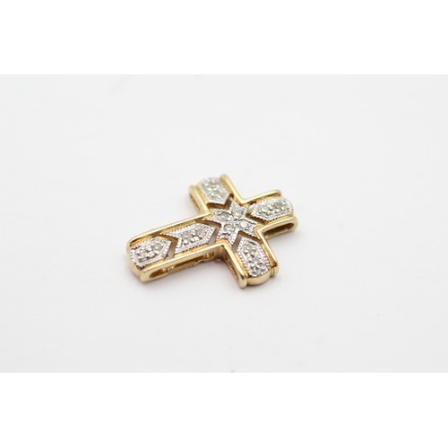 99 - 14ct gold diamond set cross pendant (1.2g)         8971