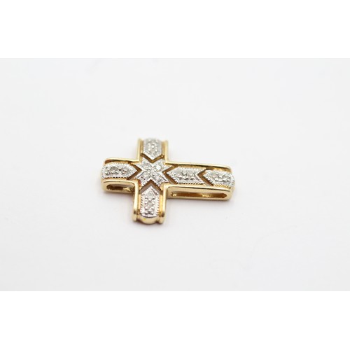 99 - 14ct gold diamond set cross pendant (1.2g)         8971