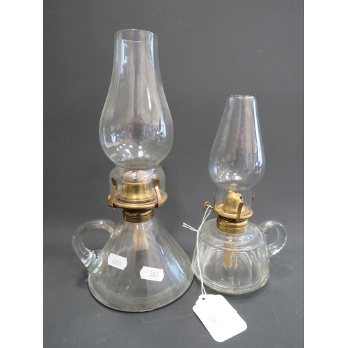 306 - Antique, Ships style oil lamp with clear glass reservoir & chimney plus one other. Largest being app... 