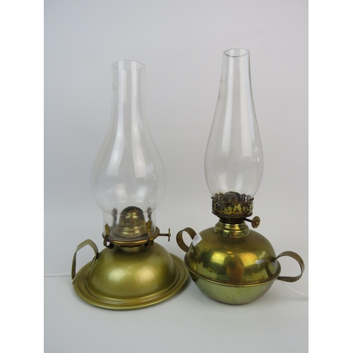 308 - Pair of Vintage oil lamps with brass reservoirs & Glass chimneys each approx 10 inches tall. See pho... 